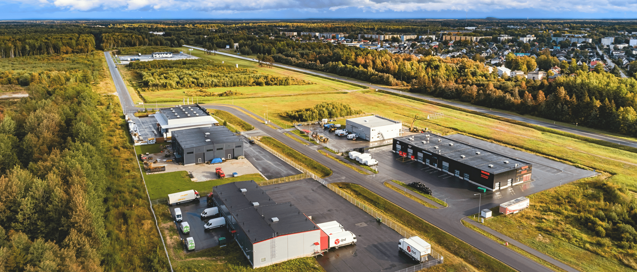 IVIA Jõhvi Business Park on Narva Road in Jõhvi, featuring a modern business and industrial environment with a variety of commercial and production buildings