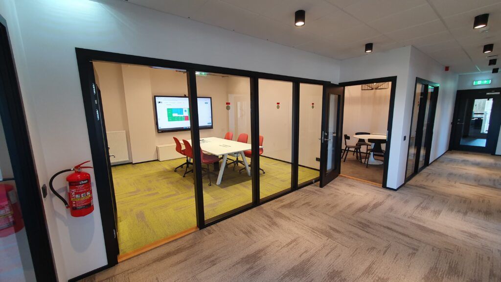 View of the meeting room and dining area from the corridor