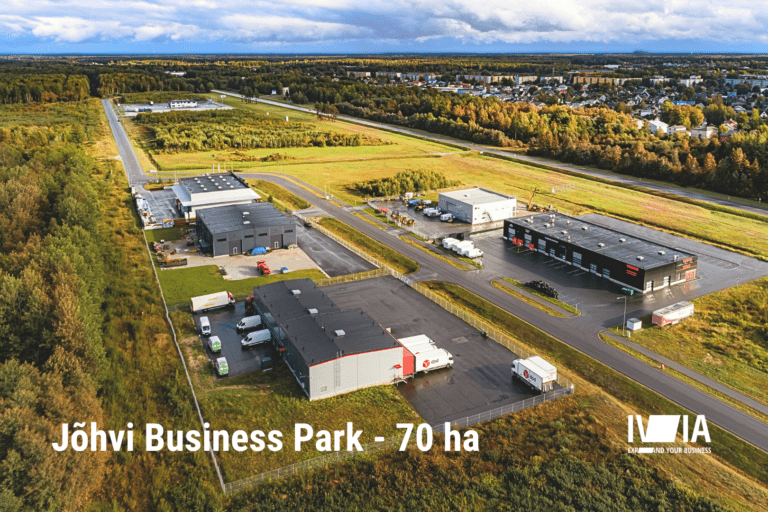 IVIA Jõhvi Business Park with industrial buildings, the E20 highway on the right, and the town of Jõhvi in the background; photo by Pjotr Aleksandrov.