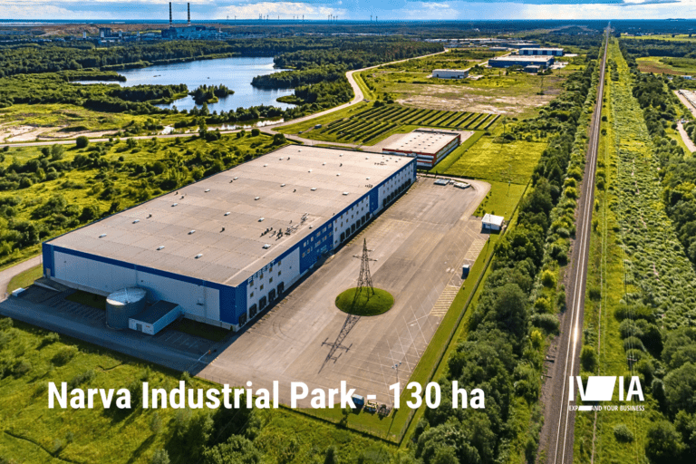 IVIA Narva Industrial Park with industrial buildings, a solar park, and in the background a power plant and wind turbines; photo by Pjotr Aleksandrov